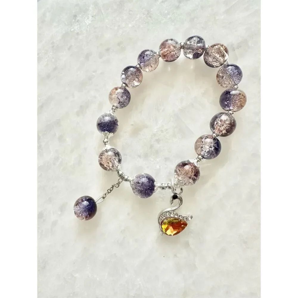 Light purple swan beaded charm bracelet 